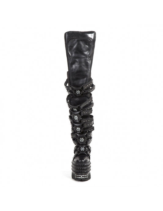 Black knee-high boot with decorative straps on a white background