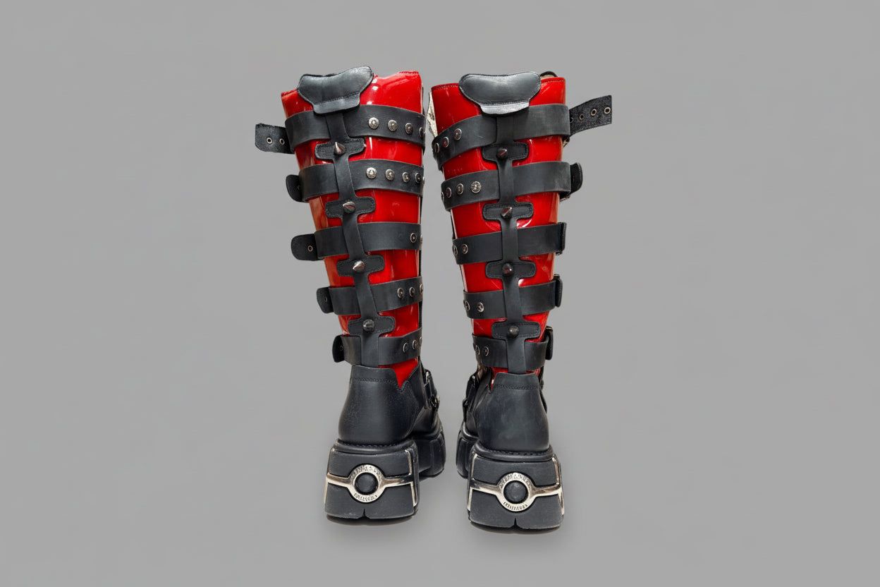 Pair of red and black knee pads on a white background