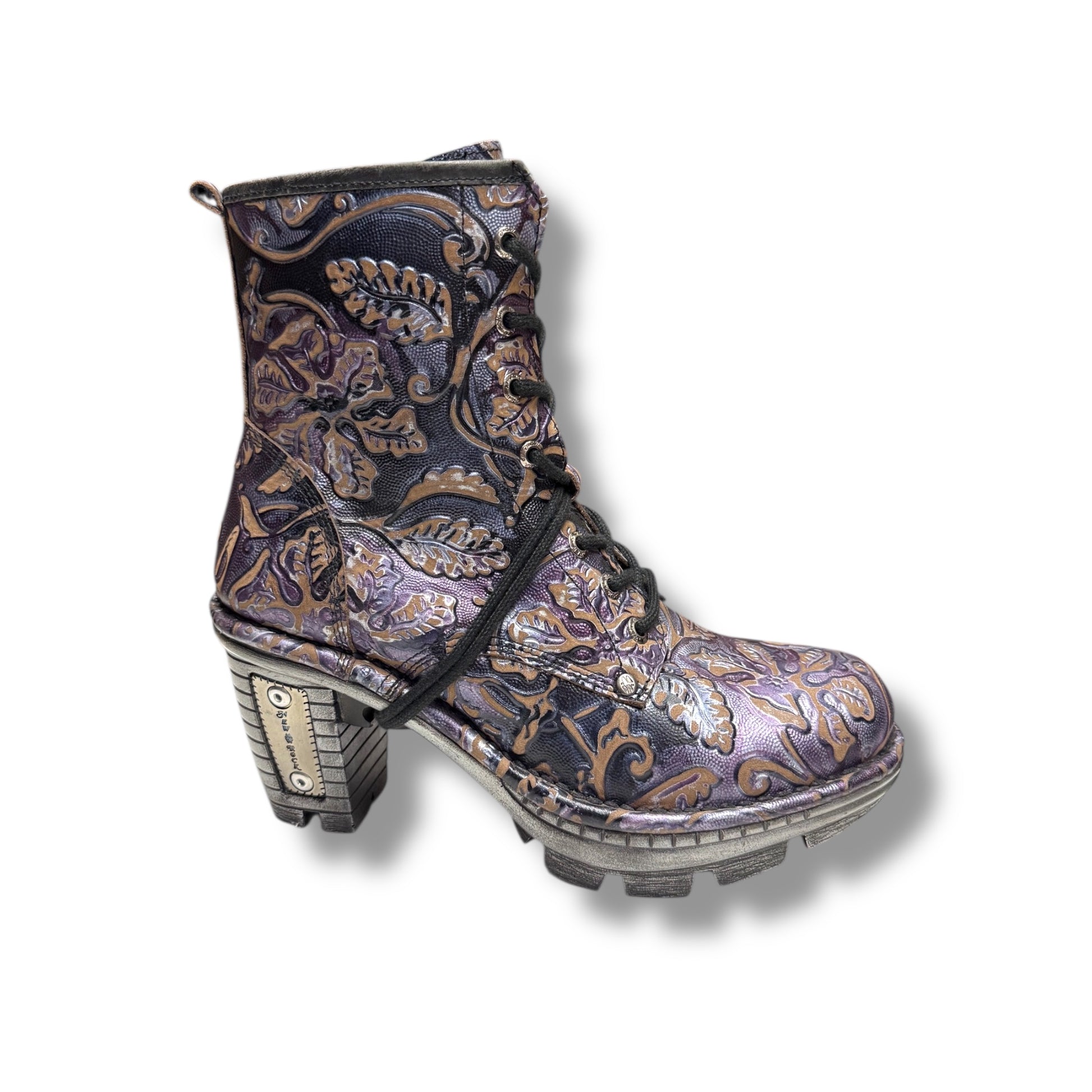 Decorative boot with intricate patterns on a white background