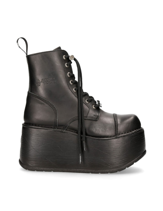 Black platform boot on a white background