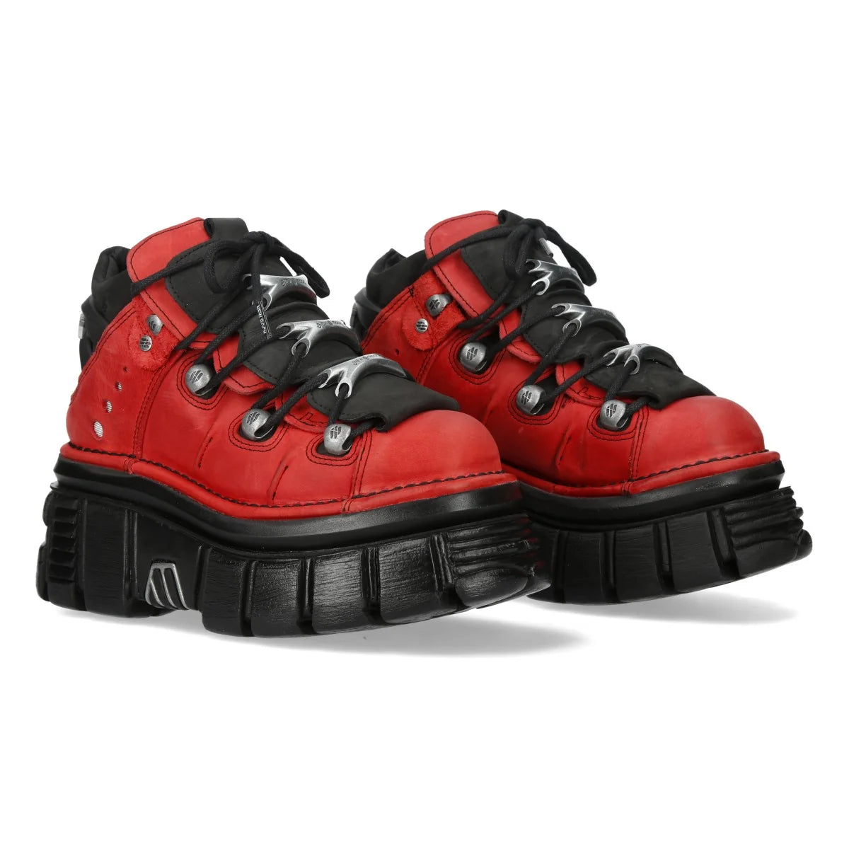 Red and black high-top sneakers with thick soles on a white background