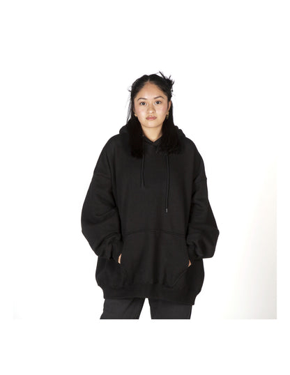 Person wearing a black hoodie on a white background
