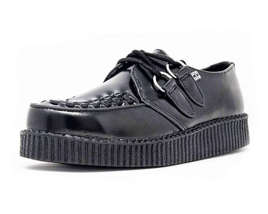 A black leather low creeper shoe with a lace-up closure and a ridged rubber sole.