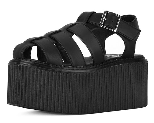 A black platform sandal with strappy upper straps and a buckle closure.