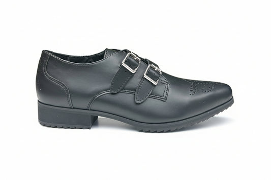 A pair of black T.U.K brand 2 buckle point sharktooth shoes with a lace-up closure and a sharktooth design on the toe.