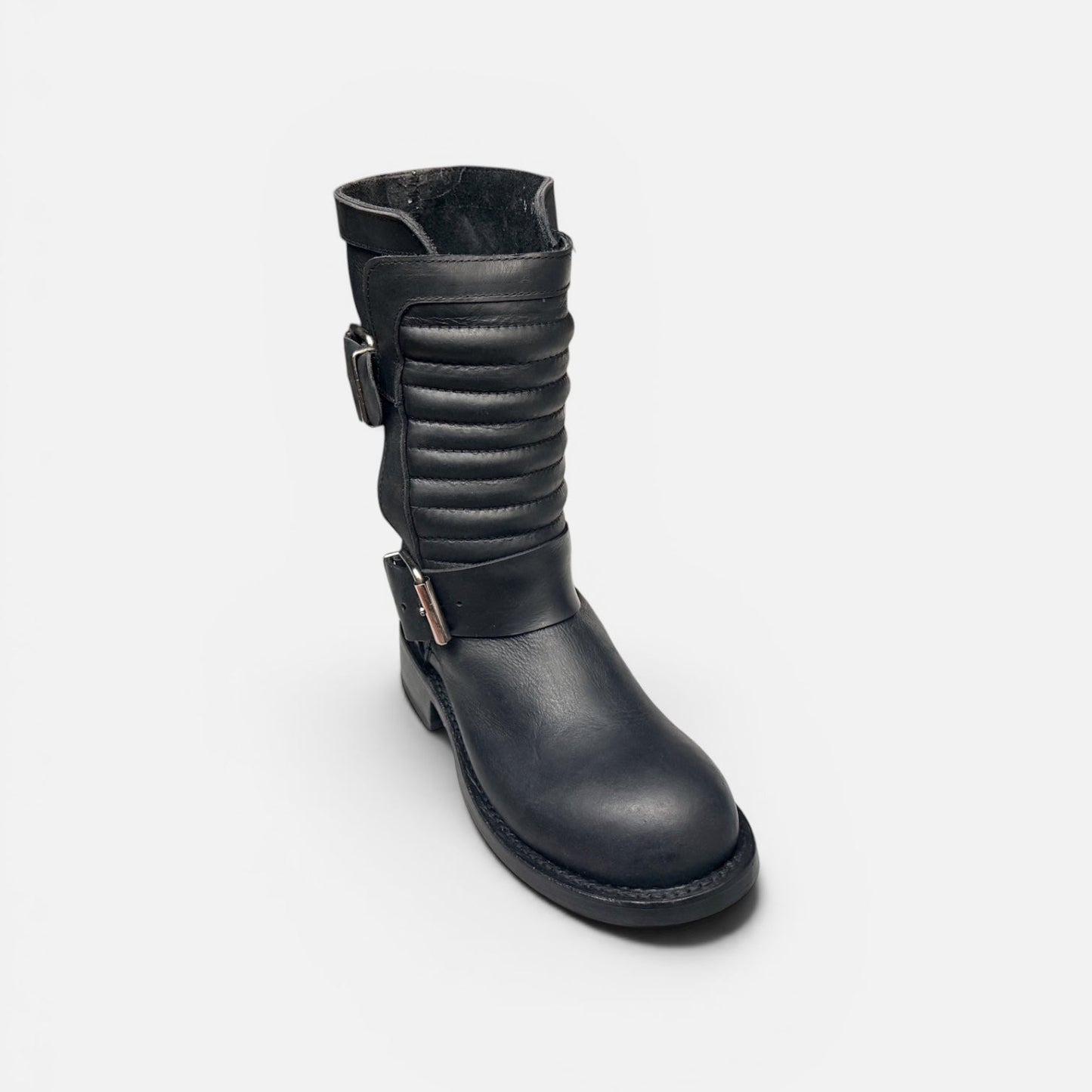 Black leather boot on a white background