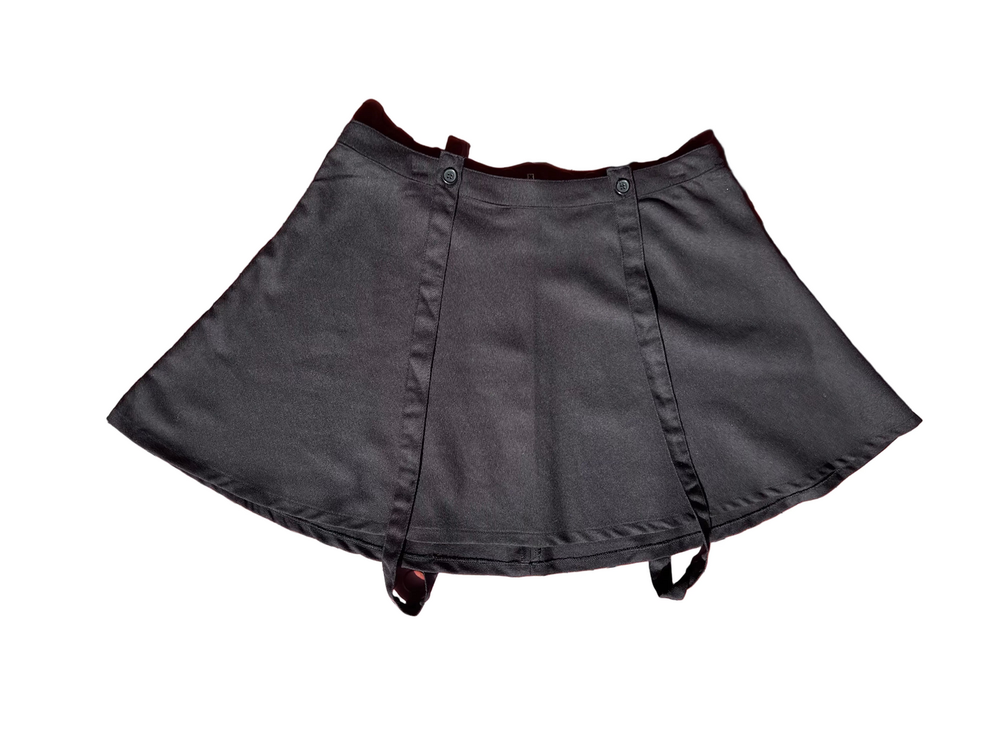 Black skirt on a textured pink surface