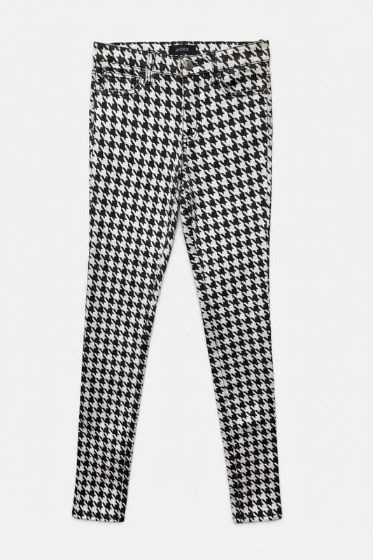 Houndstooth patterned pants on a white background