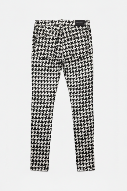 Houndstooth patterned pants on a white background