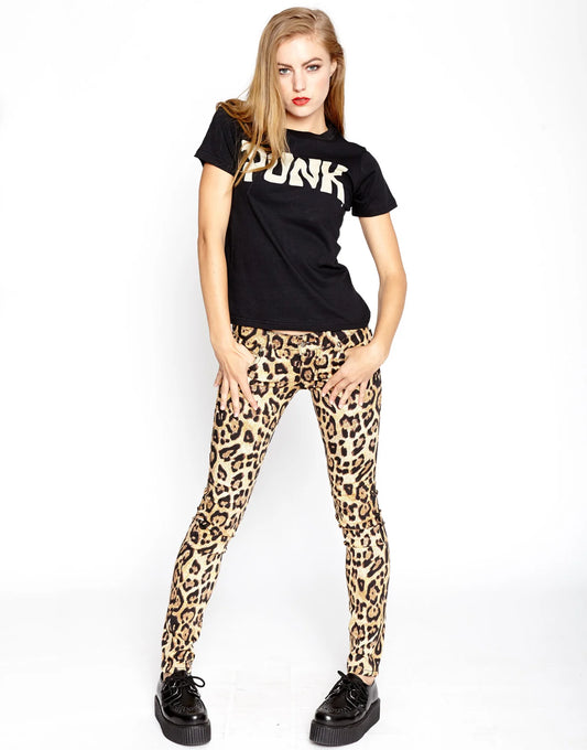 Woman wearing a black t-shirt with 'PUNK' text and leopard print pants on a white background