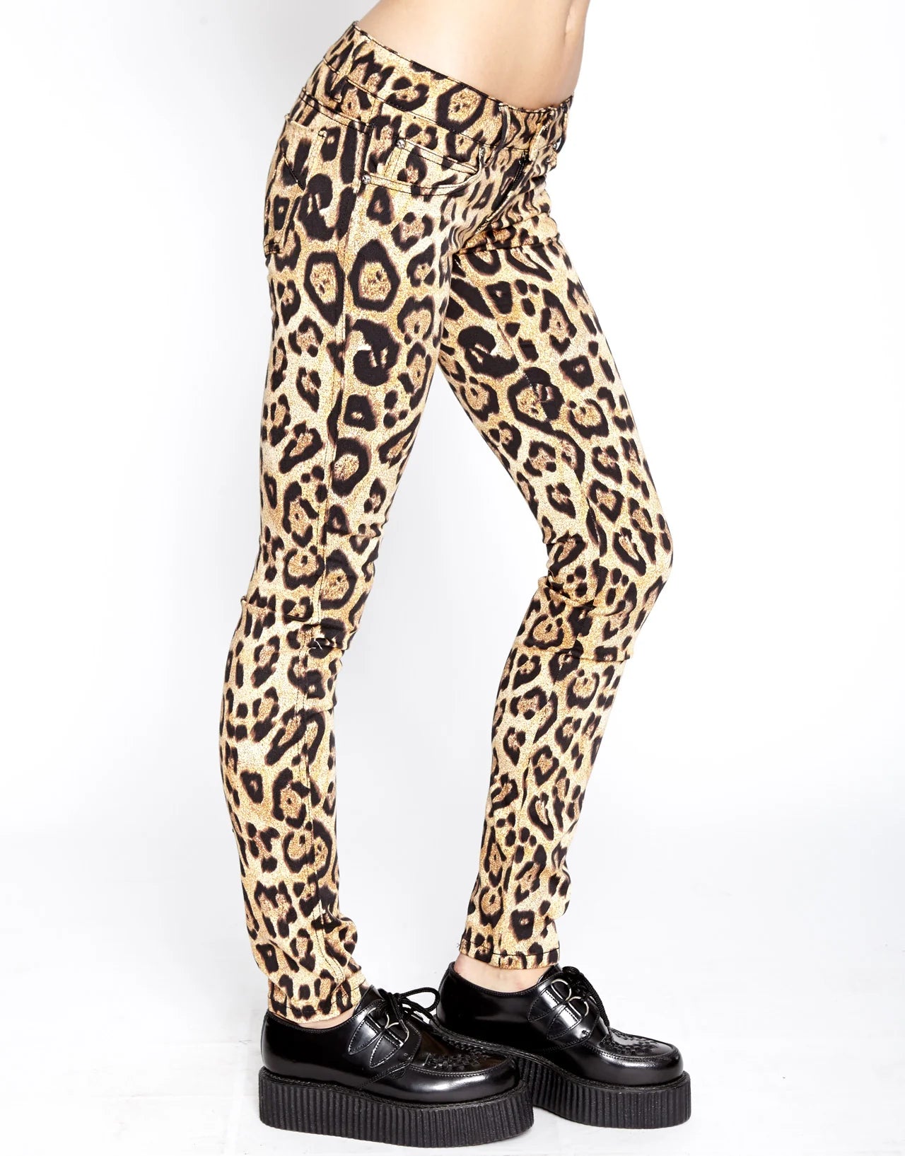 Leopard print pants worn by a person on a white background