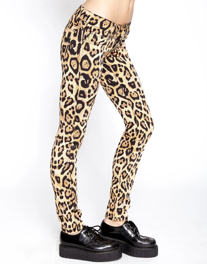 Leopard print pants worn by a person on a white background