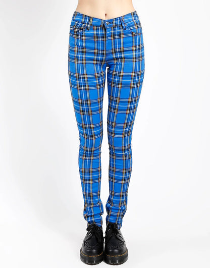 Blue plaid pants worn by a person on a white background