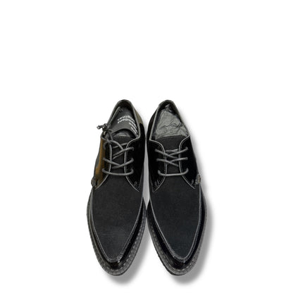 Black leather shoes on a white background