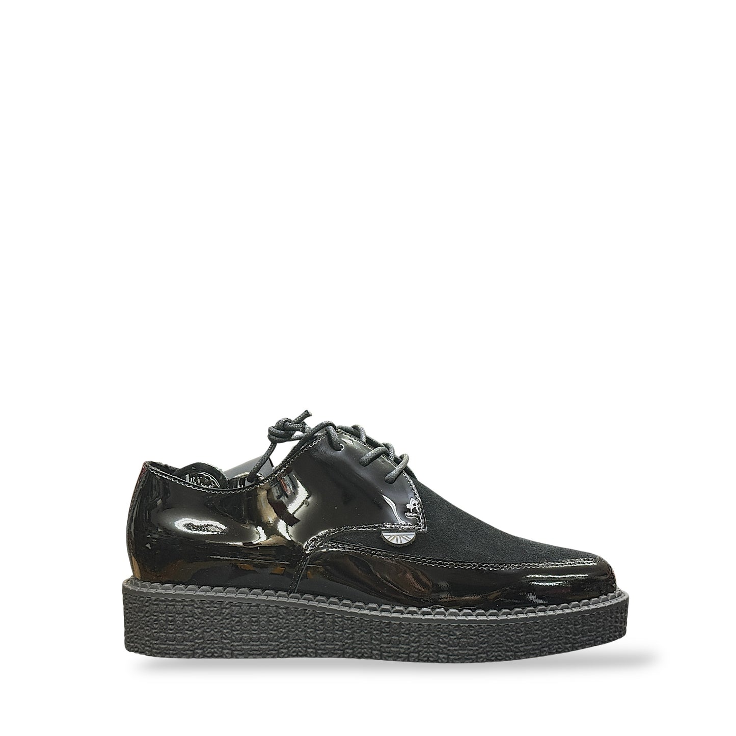 Black patent leather shoe with a thick sole on a white background