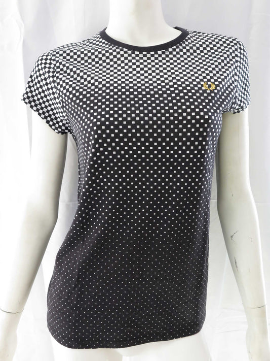 Black and white checkered shirt on a mannequin against a white background