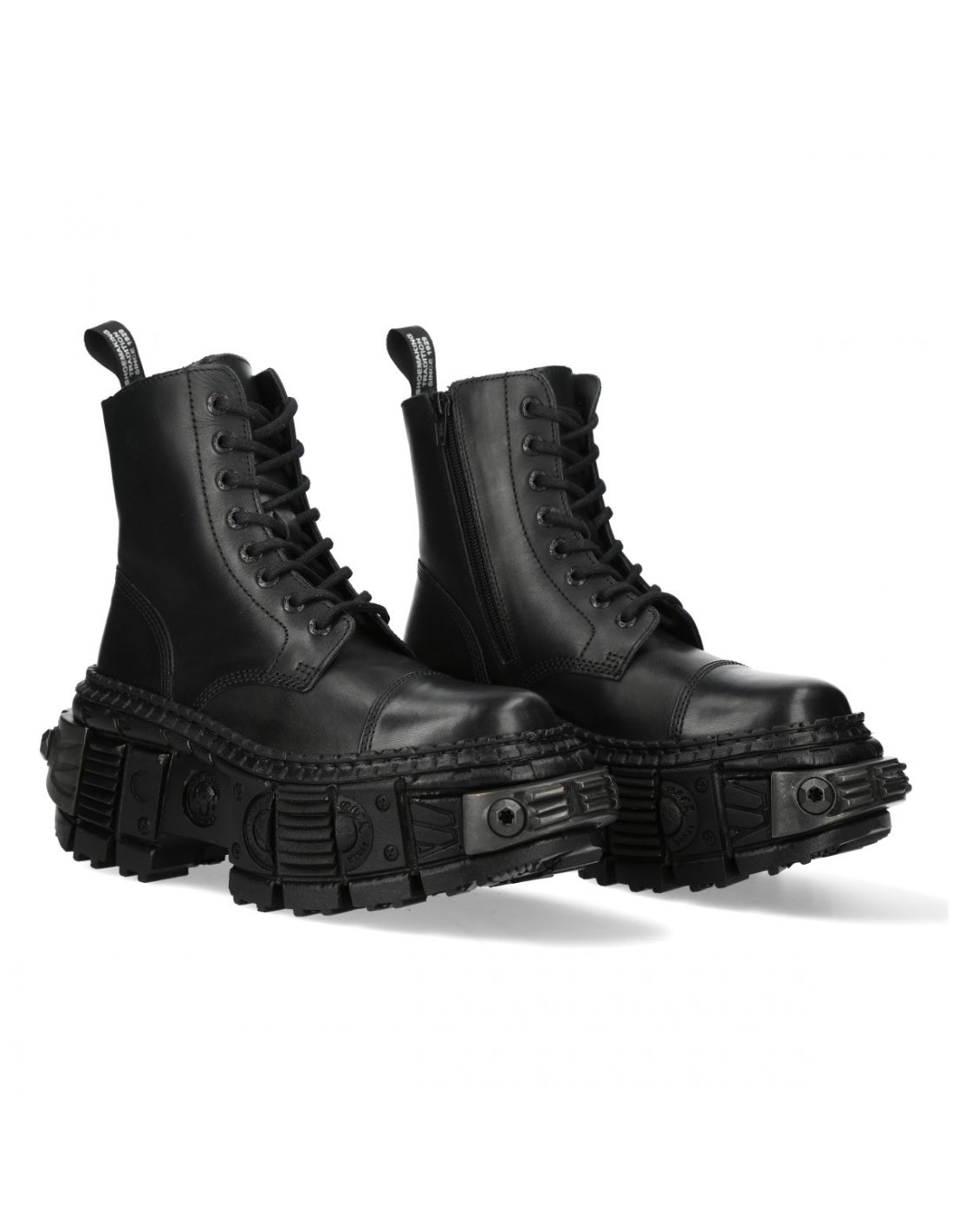 Pair of black leather boots with chunky soles on a white background